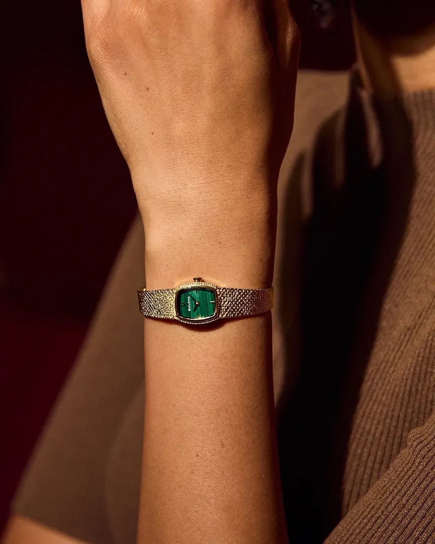 97L184 Bulova Bracelet Watch Gold Plated Stainless Steel Green Dial Goddess of Time On The Wrist Detail