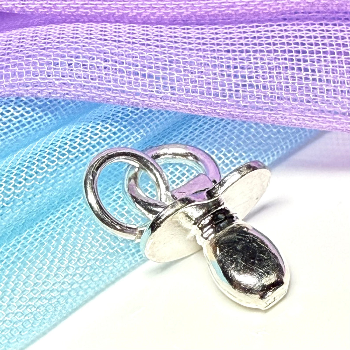 A Dummy Shaped Charm Sterling Silver Charm