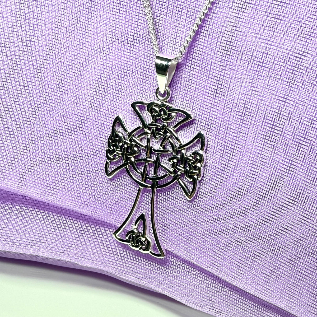 A Large Fancy Patterned Sterling Silver Celtic Cross Including Chain