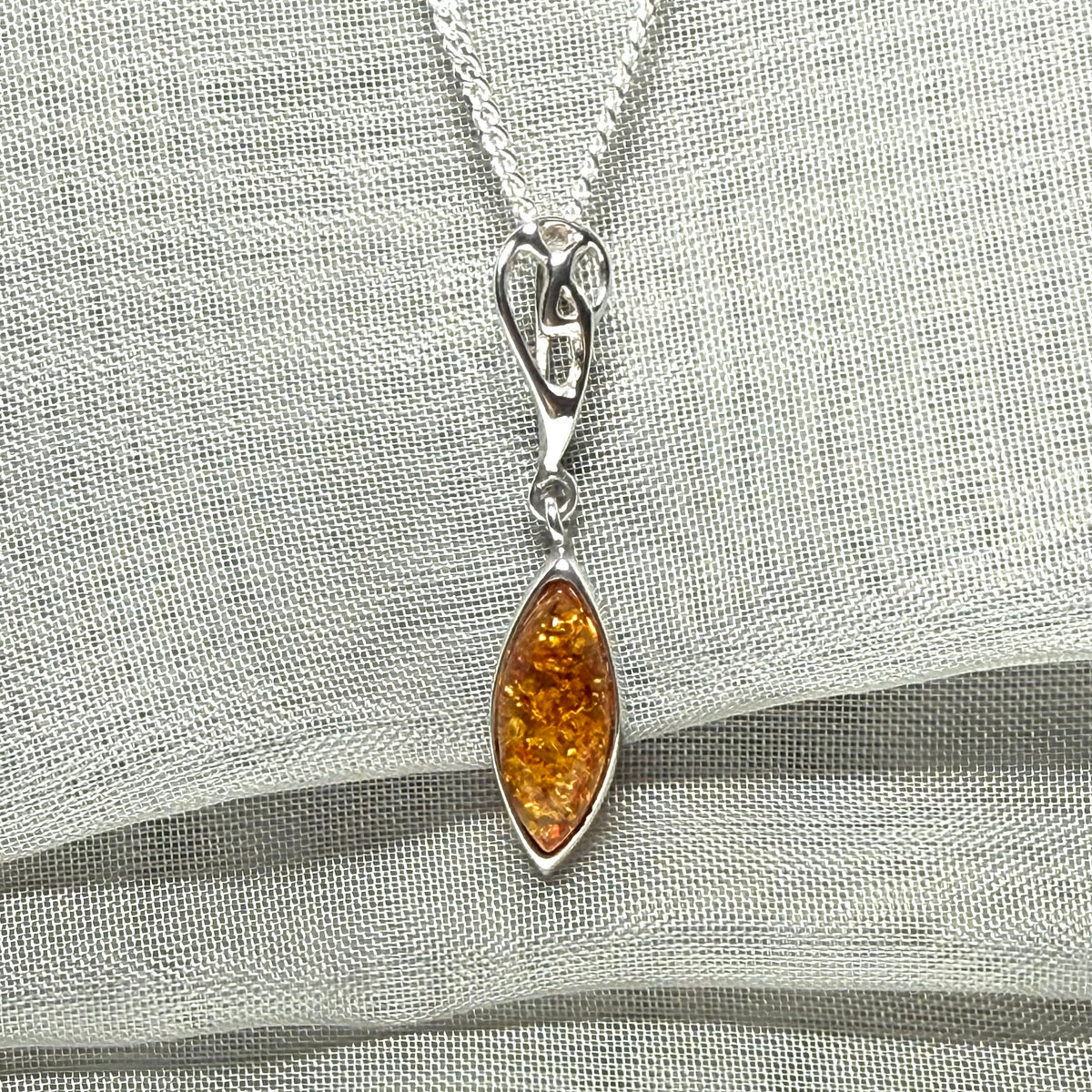 Sterling silver real amber marquise shaped necklace swirled open swirl pendant