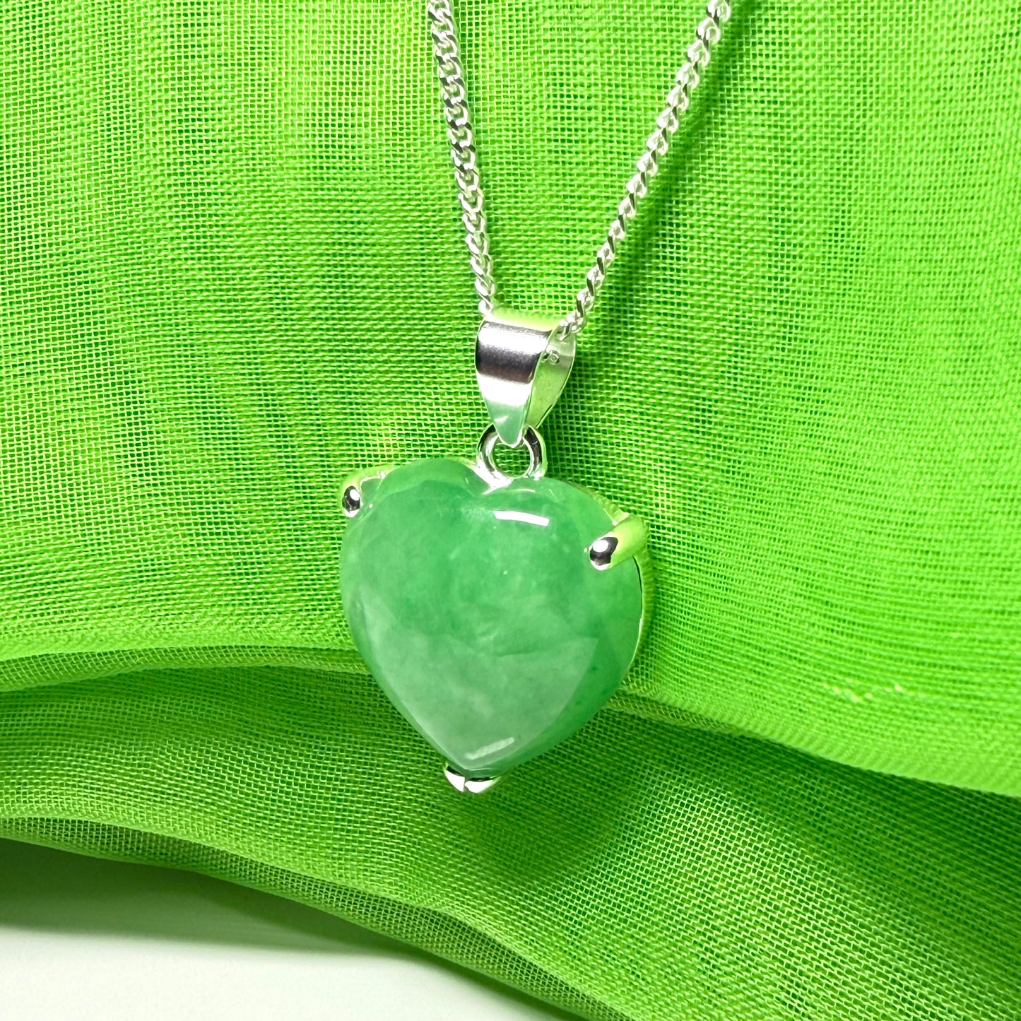 A beautiful and stunning real green jade necklace heart shaped sterling silver pendant