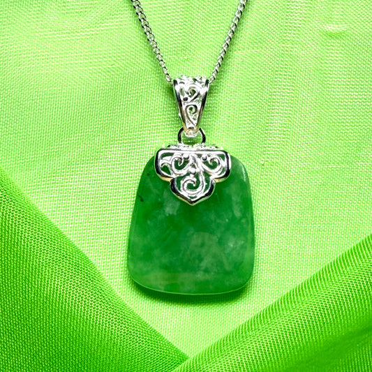 A beautiful and stunning real green jade necklace large pendant that is cushion shaped
