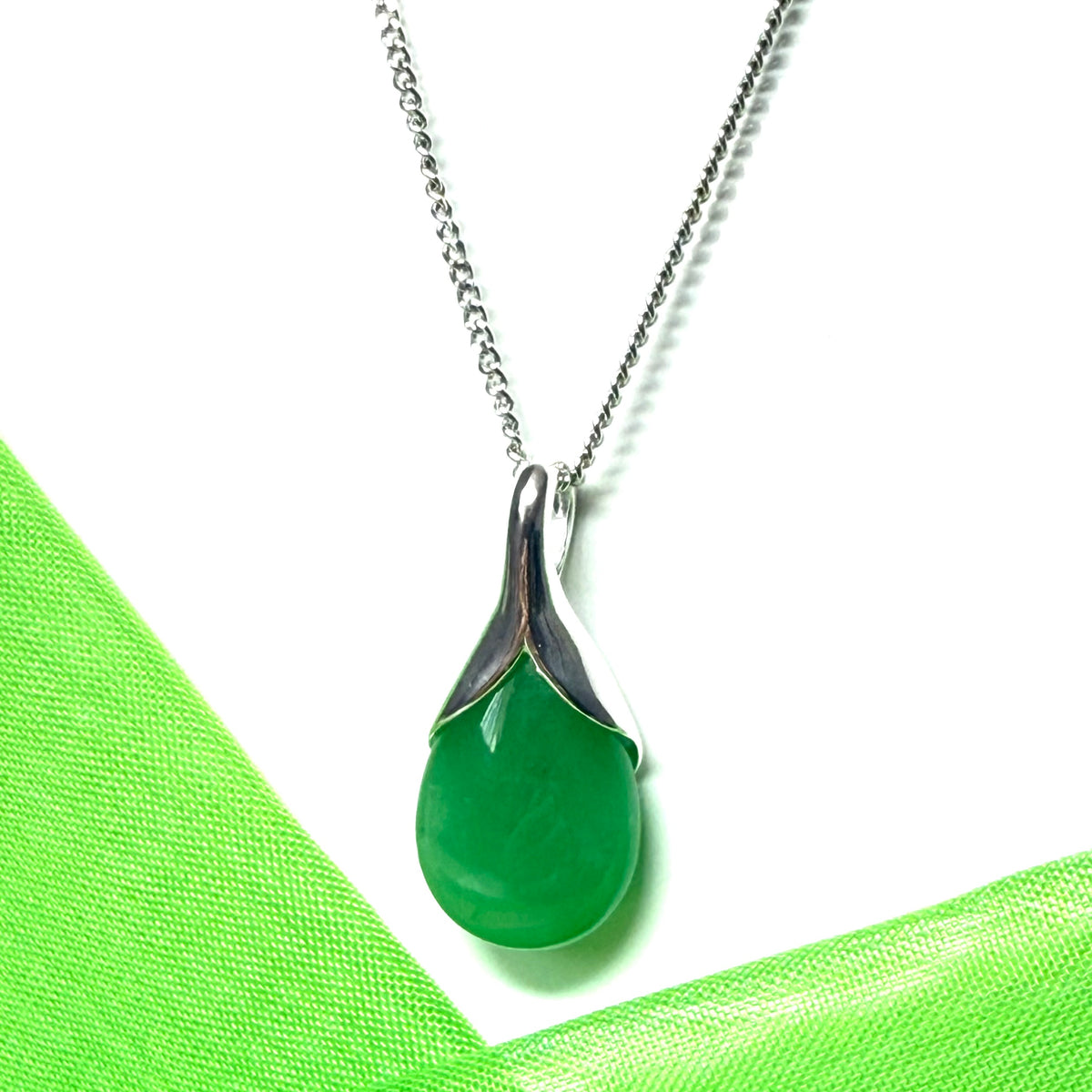 A beautiful and stunning real green jade pendant necklace in a teardrop shaped or pear shaped