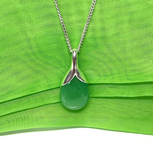 A beautiful and stunning real green jade pendant necklace in a teardrop shaped or pear shaped