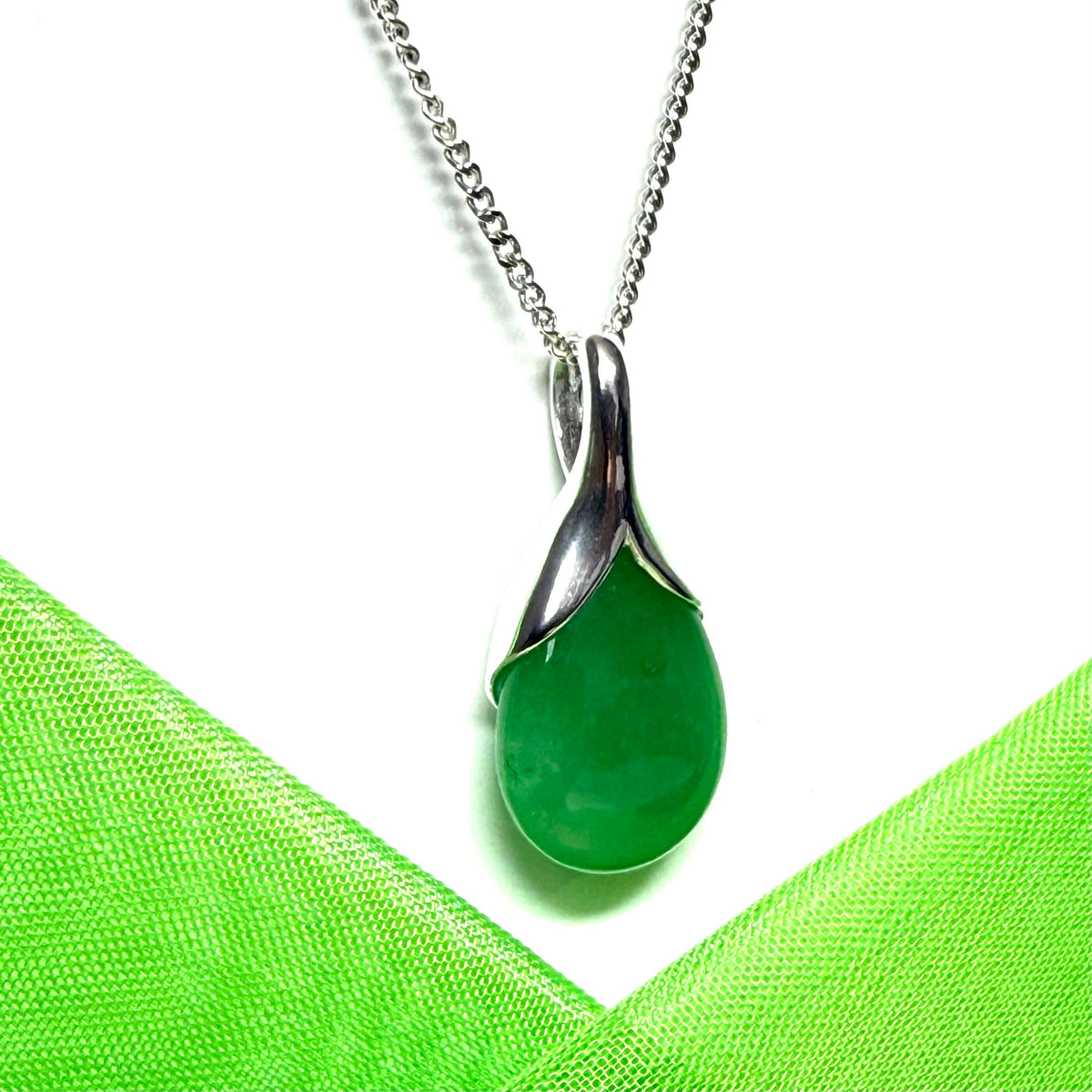 A beautiful and stunning real green jade pendant necklace in a teardrop shaped or pear shaped