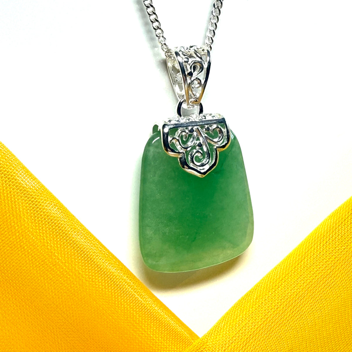 Beautiful and timeless real green jade necklace large pendant that is cushion shaped