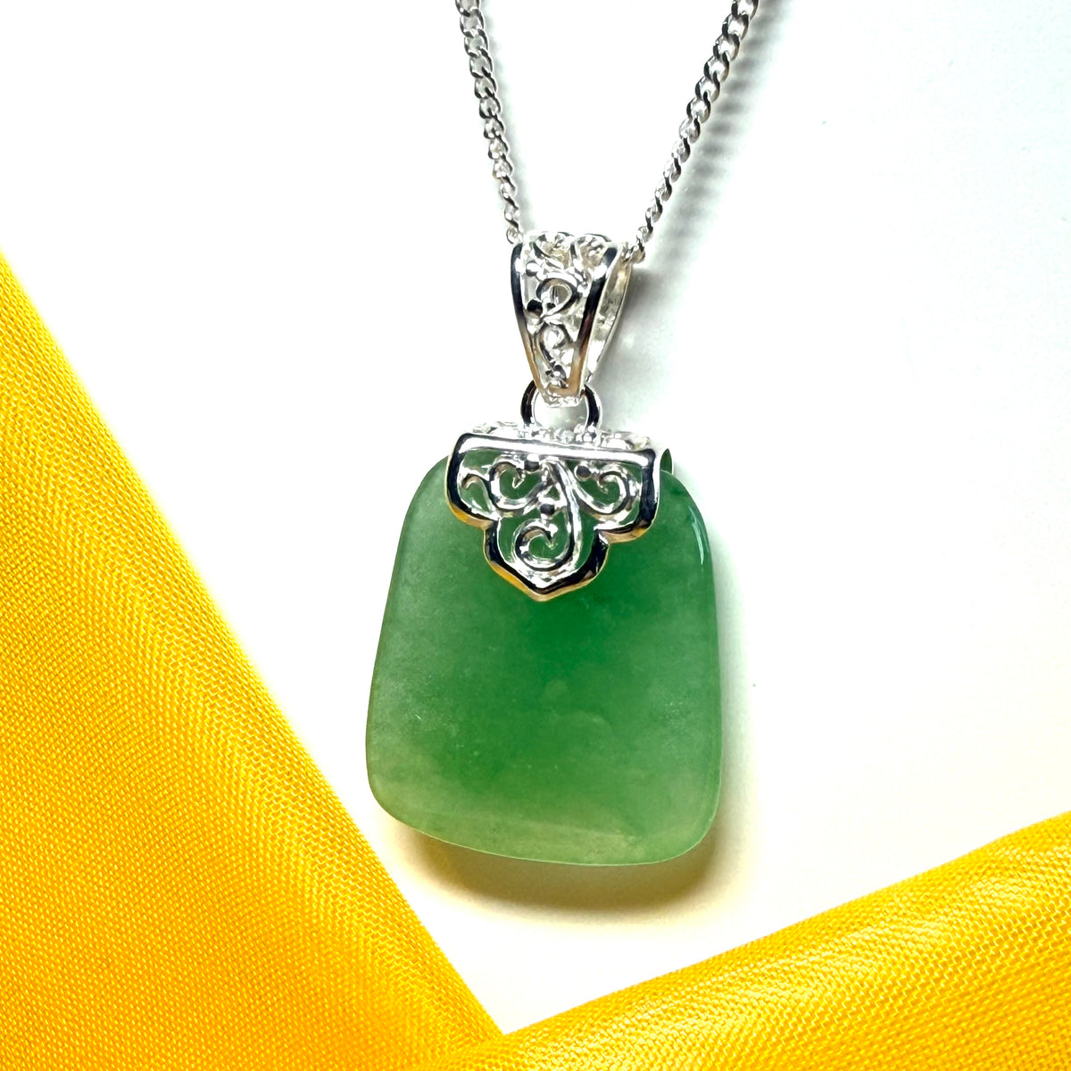 Beautiful and timeless real green jade necklace large pendant that is cushion shaped