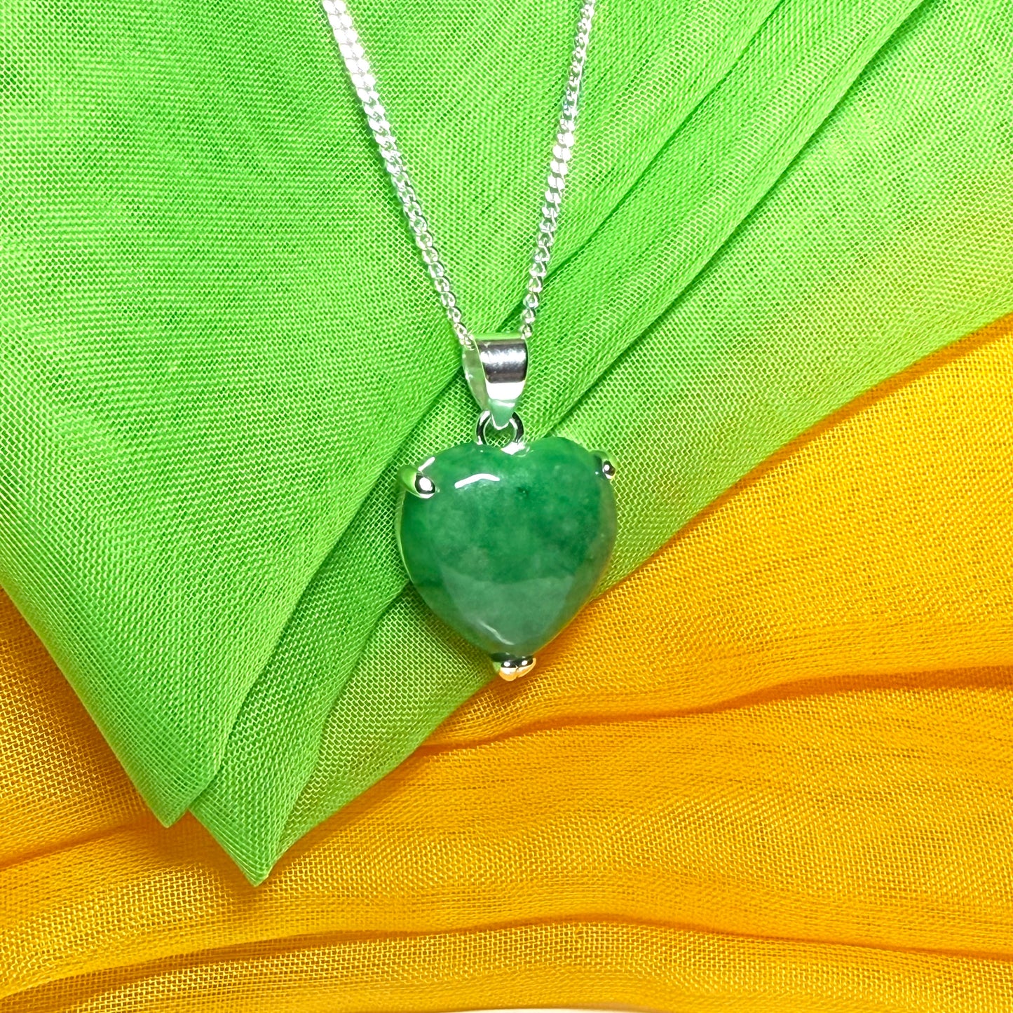 A beautiful real green jade necklace heart shape sterling silver pendant