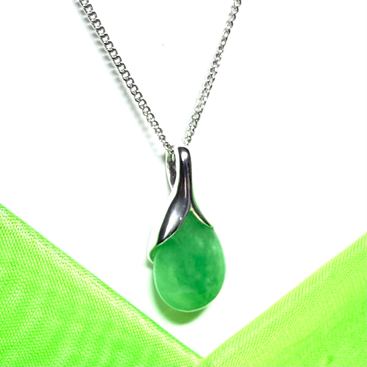 A beautiful real green jade necklace teardrop pendant pear shaped