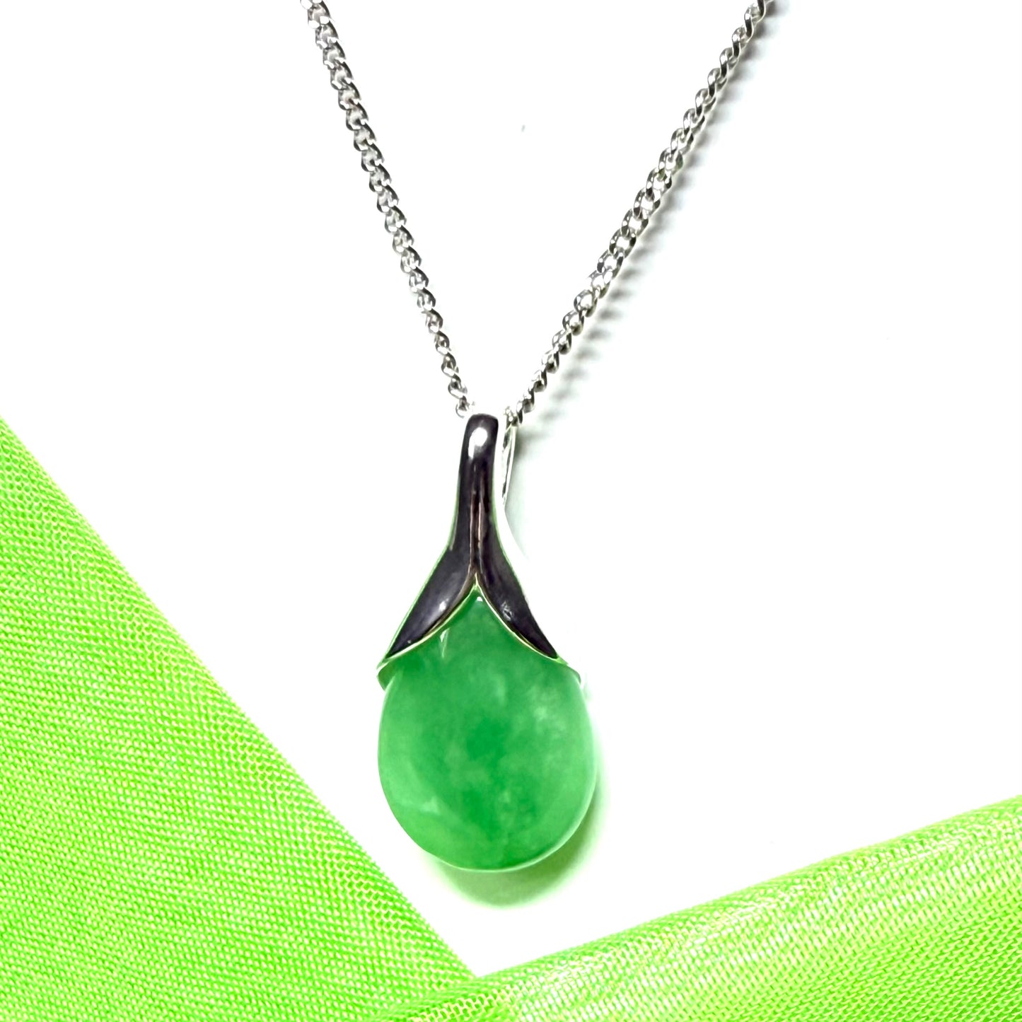 A beautiful real green jade necklace teardrop pendant pear shaped
