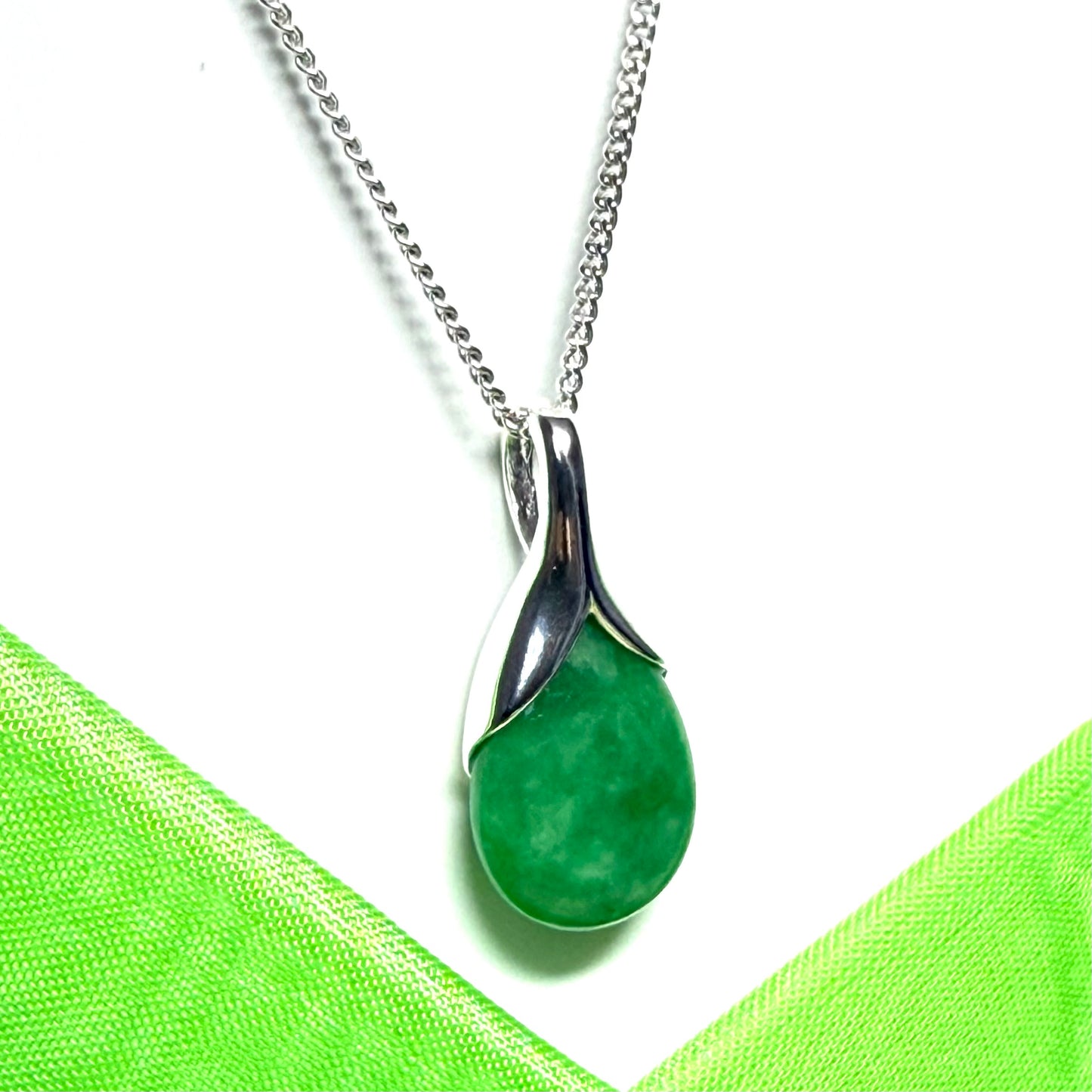 A beautiful real green jade necklace with a teardrop pendant pear shape solid curb chain included