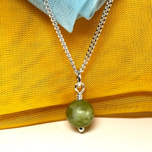 A beautiful small real green gypsum necklace ball shaped, a gorgeous round pendant