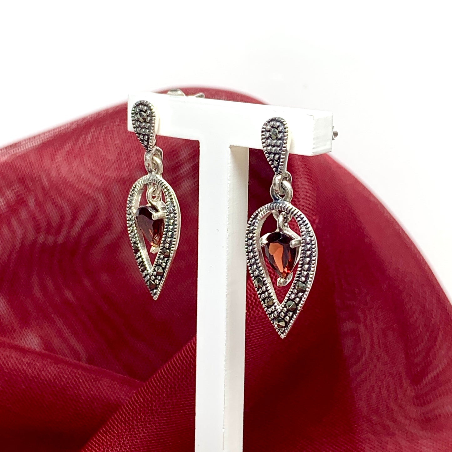 A gorgeous pair of drop earrings with real garnet stones and real marcasite stones
