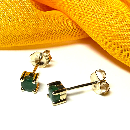 A pair of real ruby earrings round yellow gold claw set studs