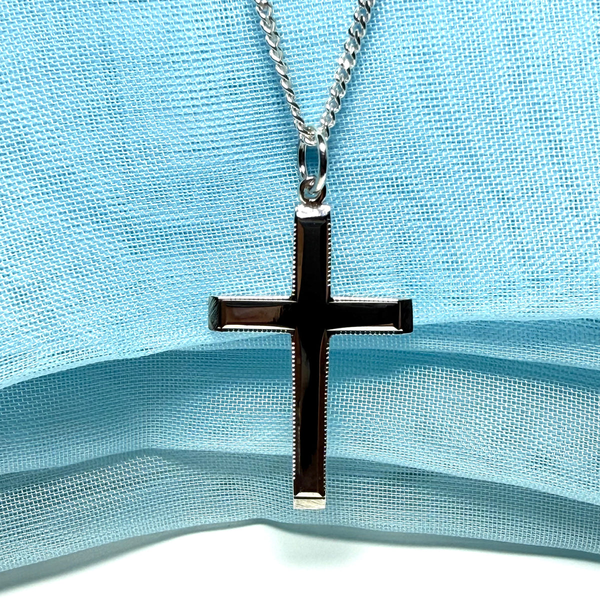Polished beaded edge solid sterling silver cross including chain