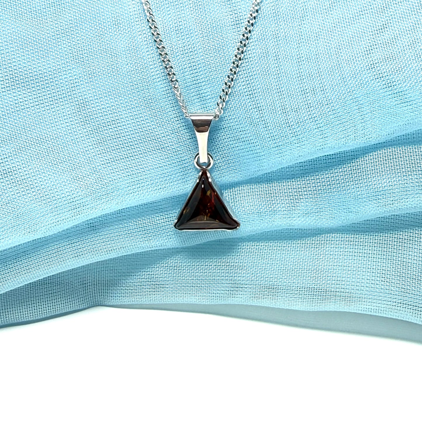 A real amber necklace sterling silver triangle shape dark amber pendant