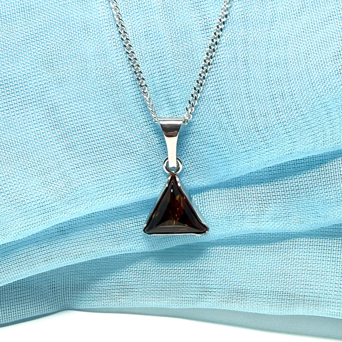A real amber necklace sterling silver triangle shape dark amber pendant