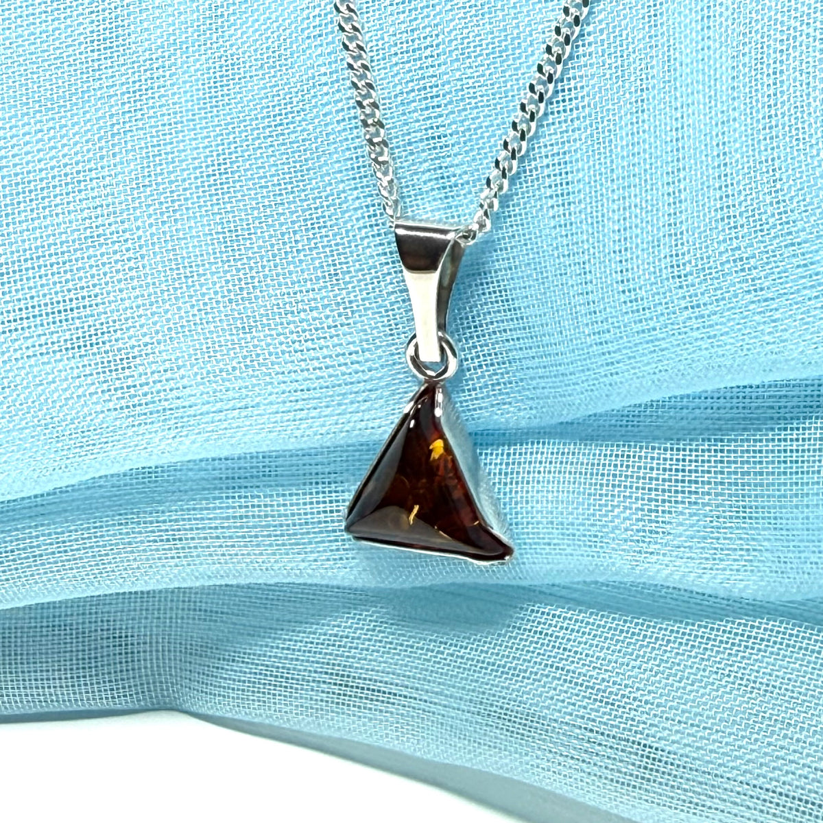 A real amber necklace sterling silver triangle shape dark amber pendant
