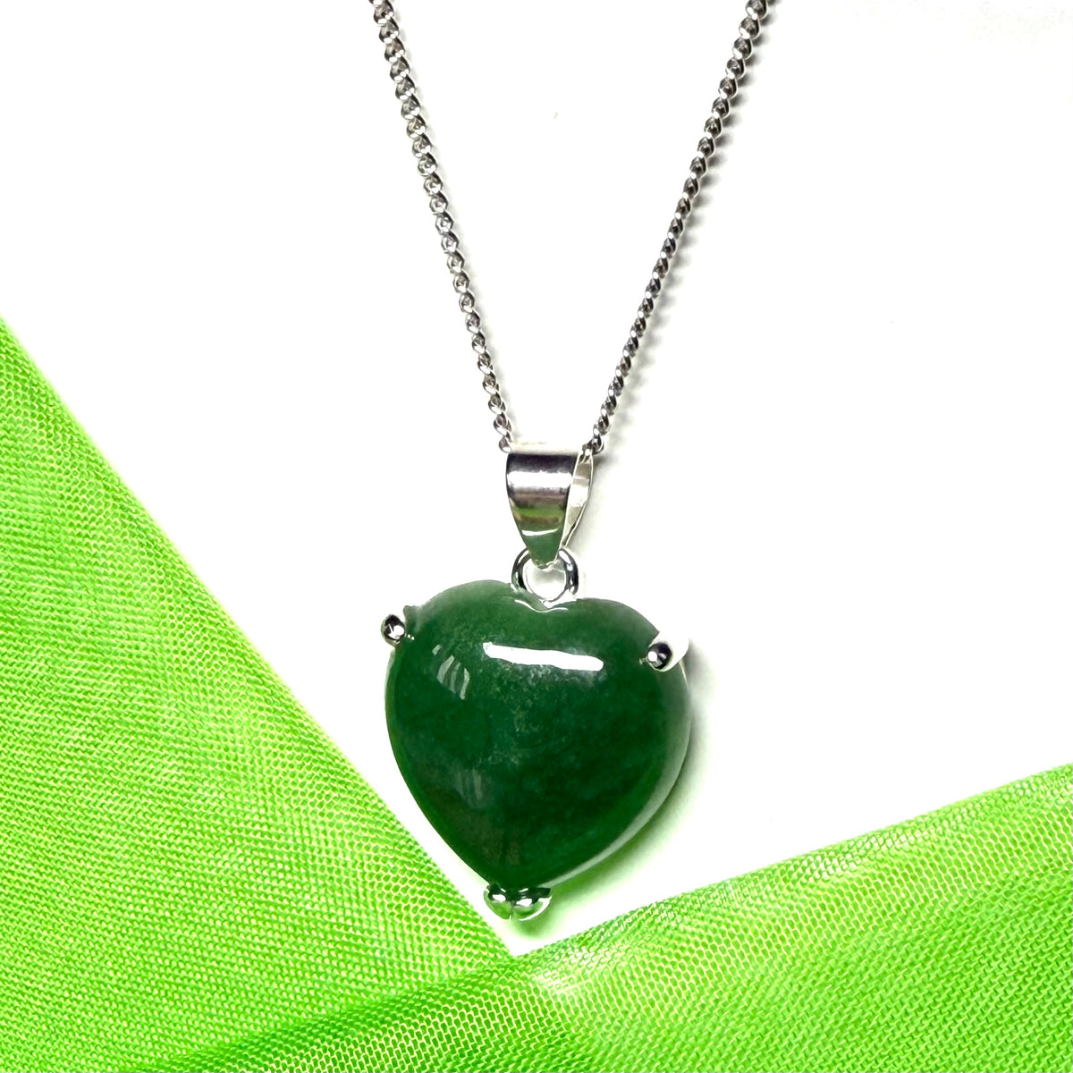 A real dark green jade necklace heart shape sterling silver pendant