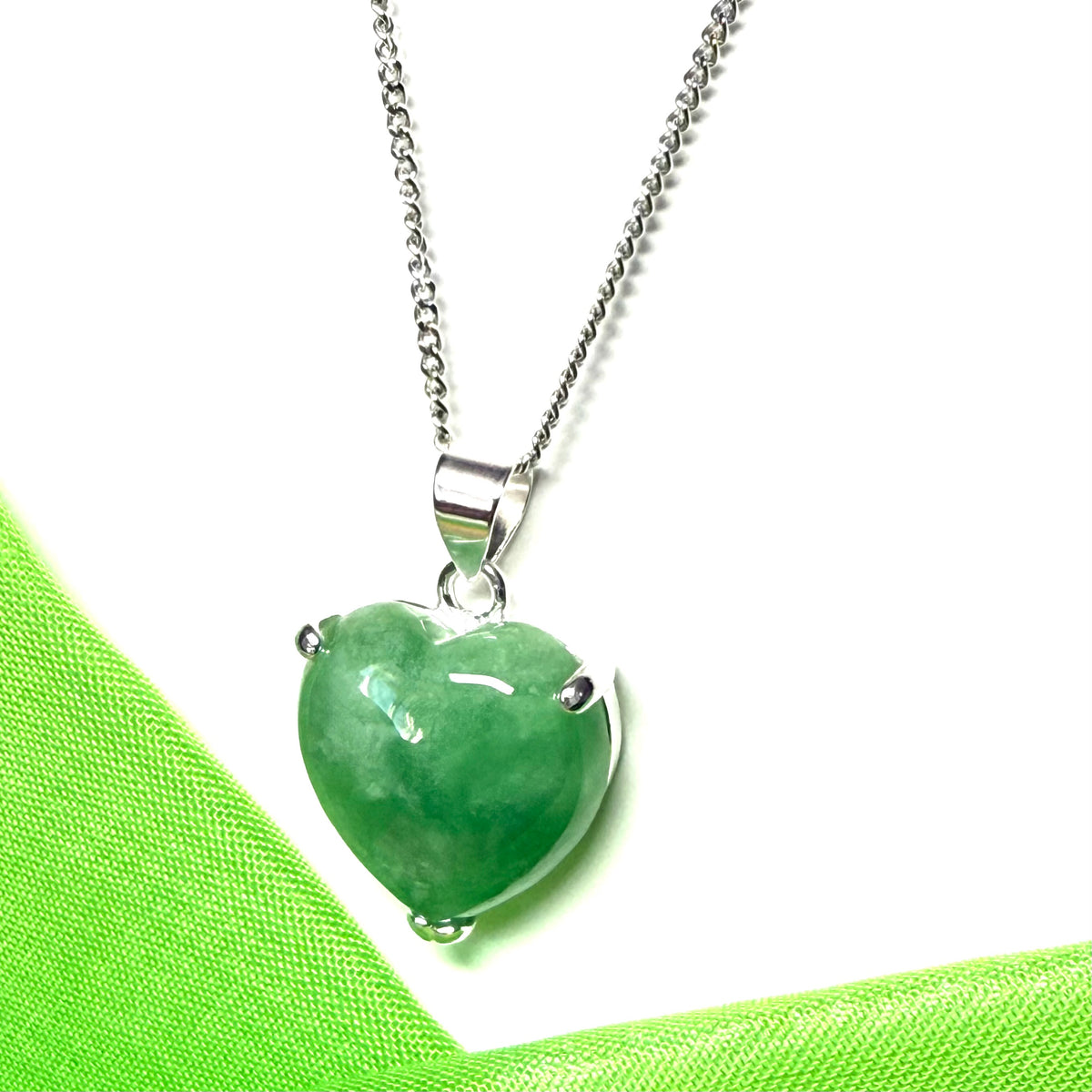 A real dark green jade pendant necklace heart shape sterling silver with a chain included
