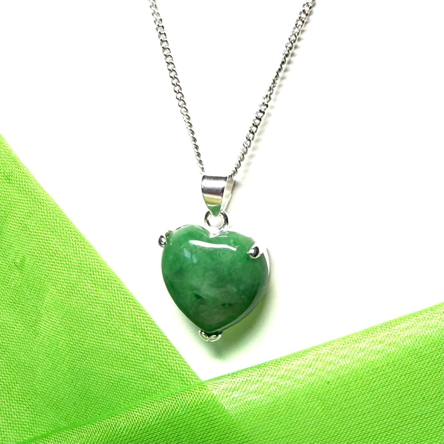 A real dark green jade pendant necklace heart shape sterling silver