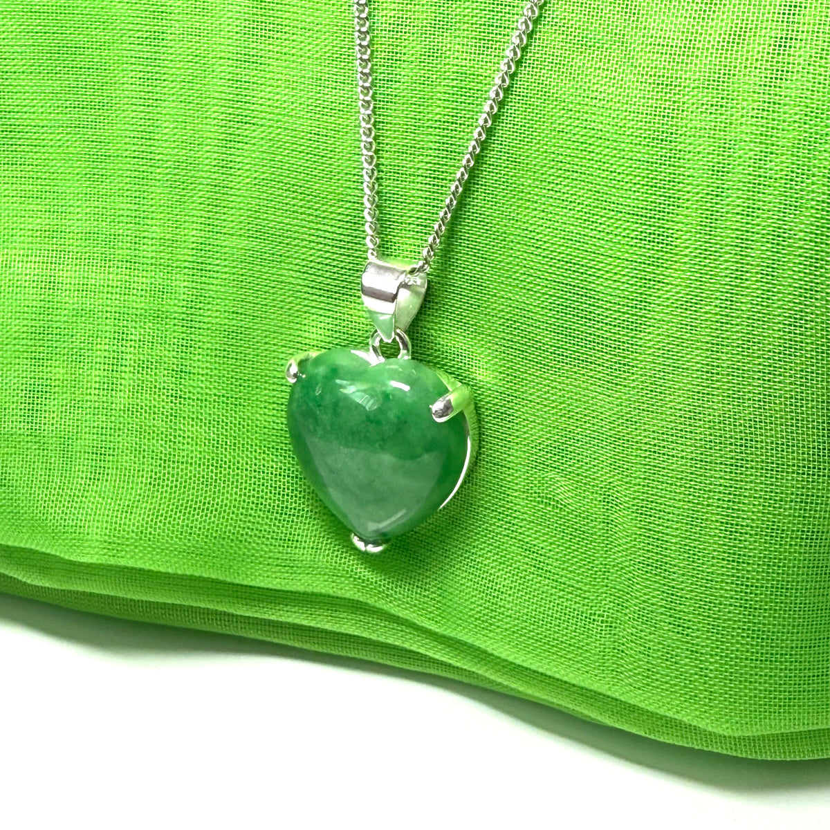 A real dark green jade pendant necklace heart shaped sterling silver setting, simply gorgeous