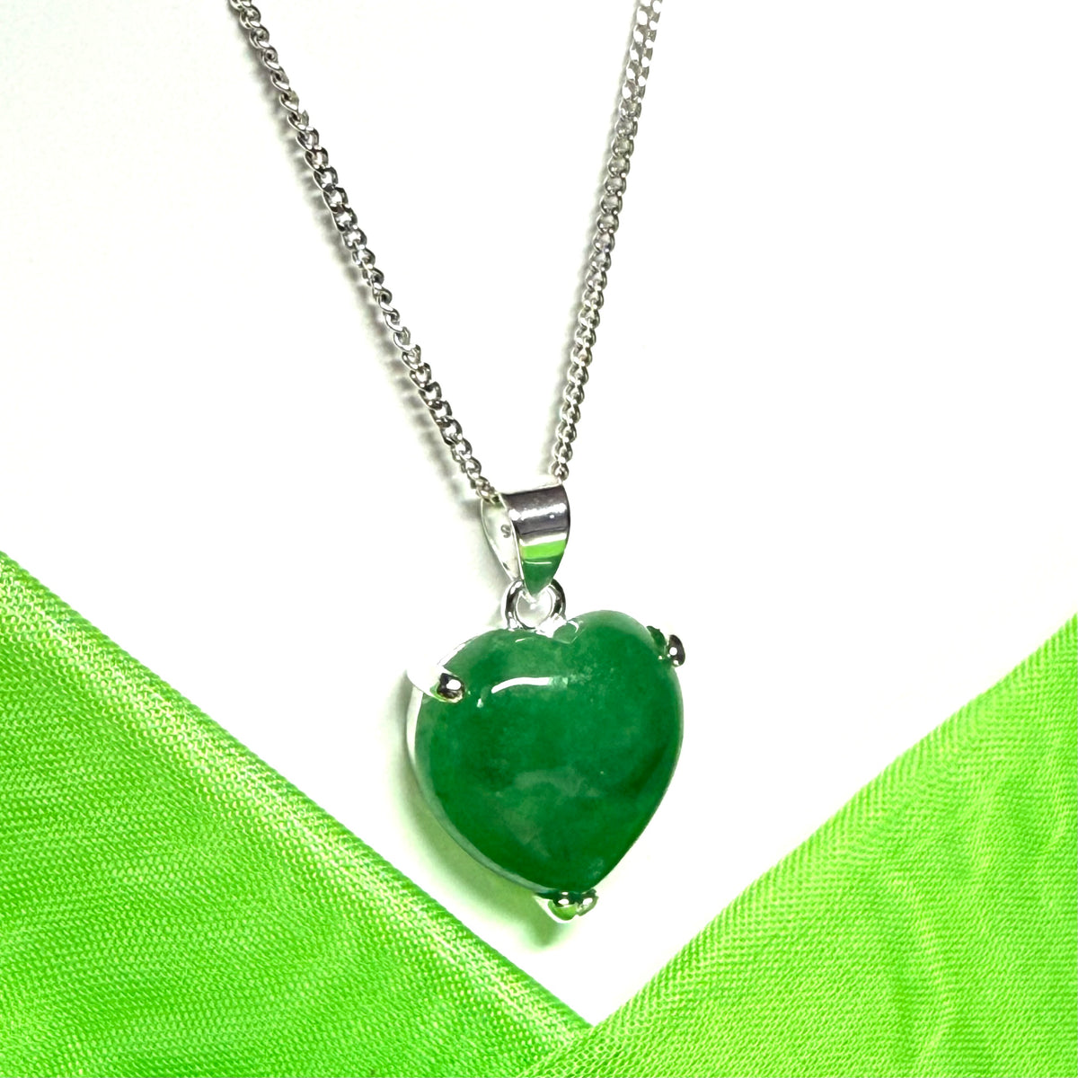 A real green jade necklace heart shape sterling silver pendant