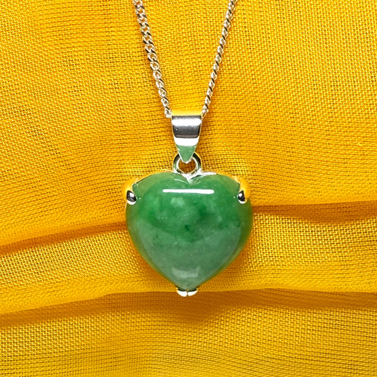 A real green jade necklace heart shape sterling silver pendant including chain
