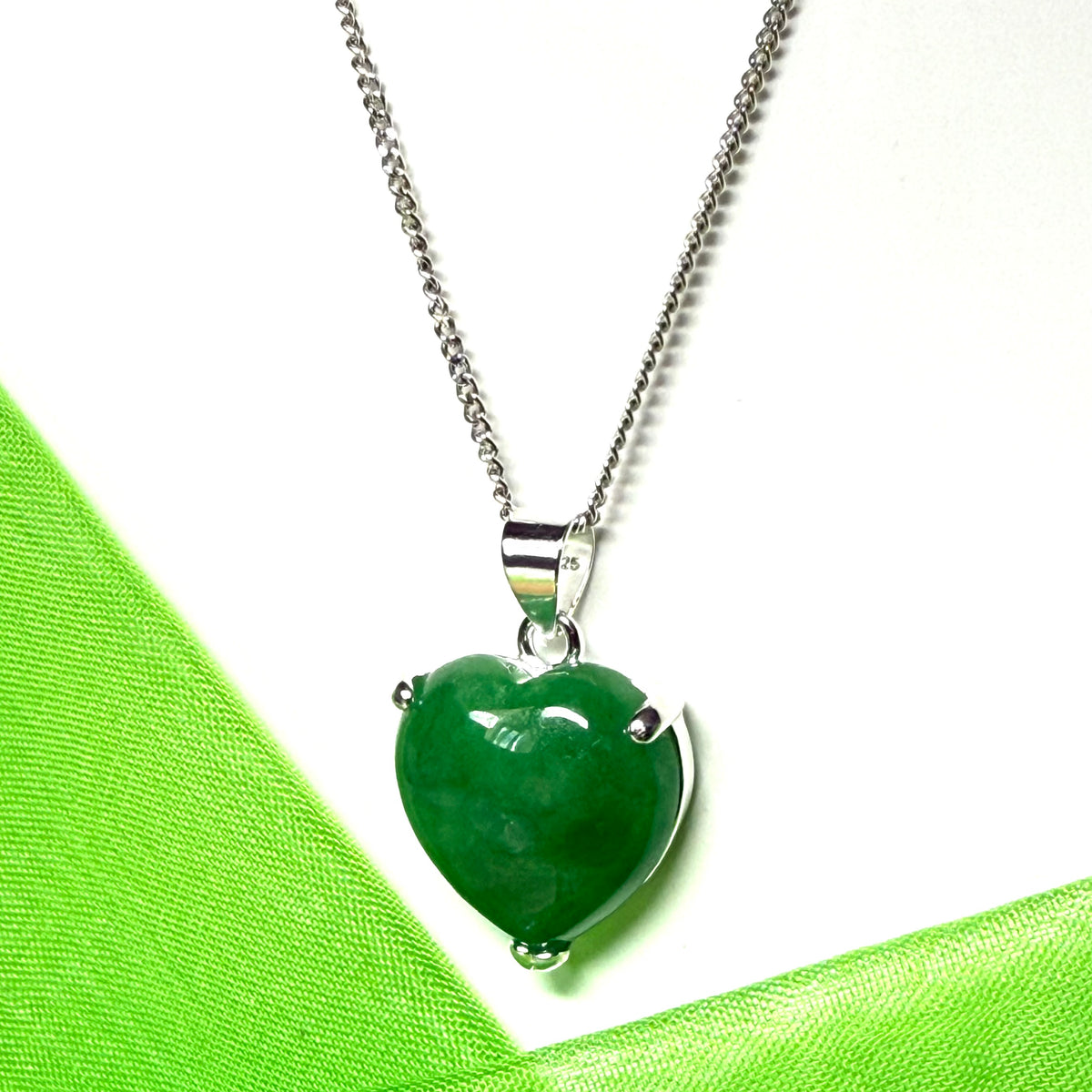 A real green jade necklace heart shape sterling silver pendant