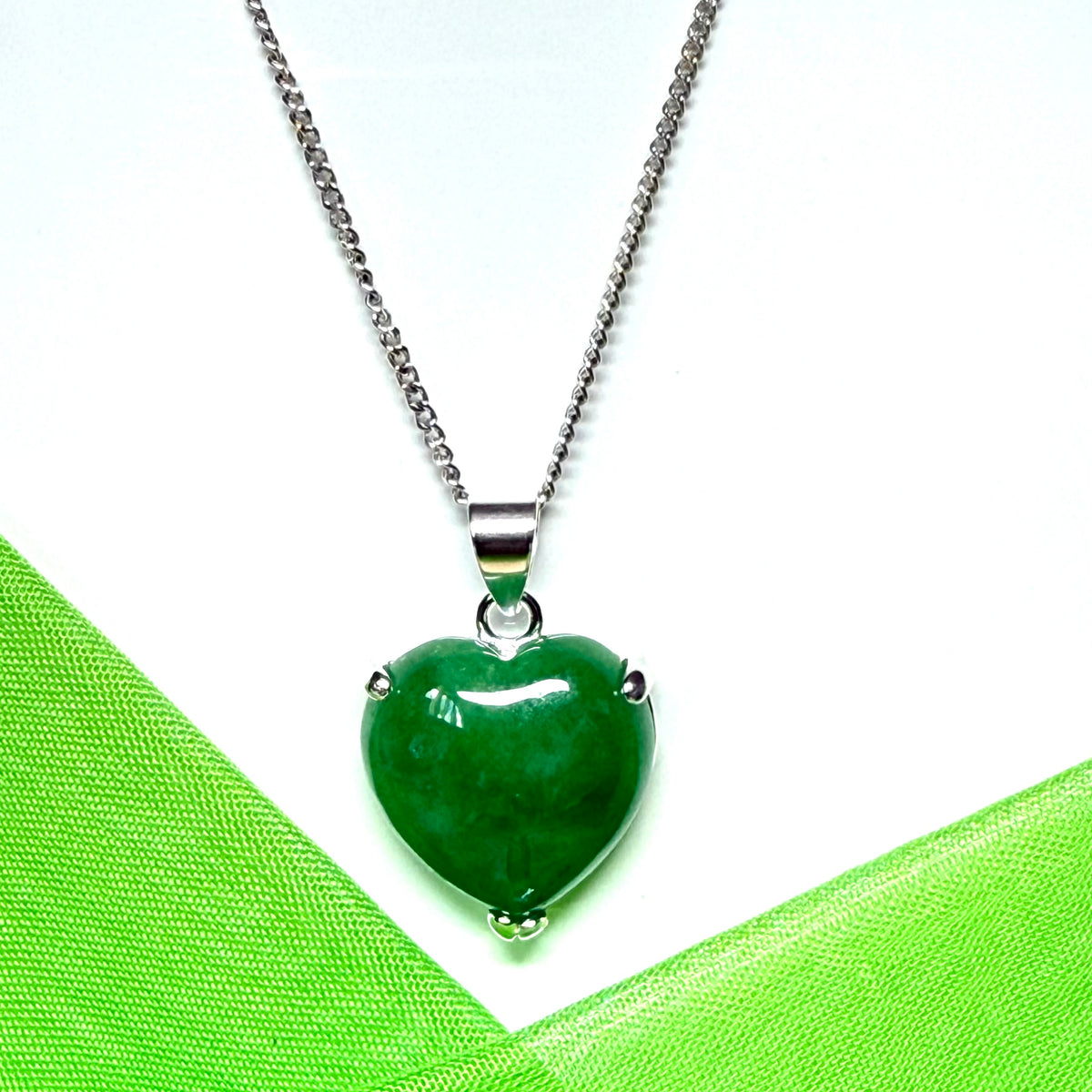 A real green jade necklace heart shape sterling silver pendant