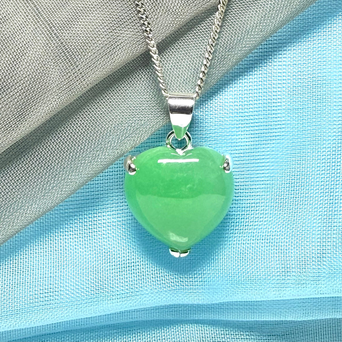 A real green jade necklace heart shaped sterling silver with chain