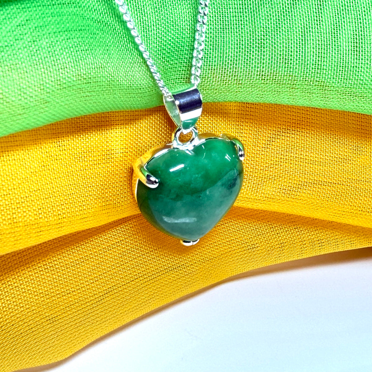 A real green jade necklace heart shaped sterling silver, an exquisite designed pendant