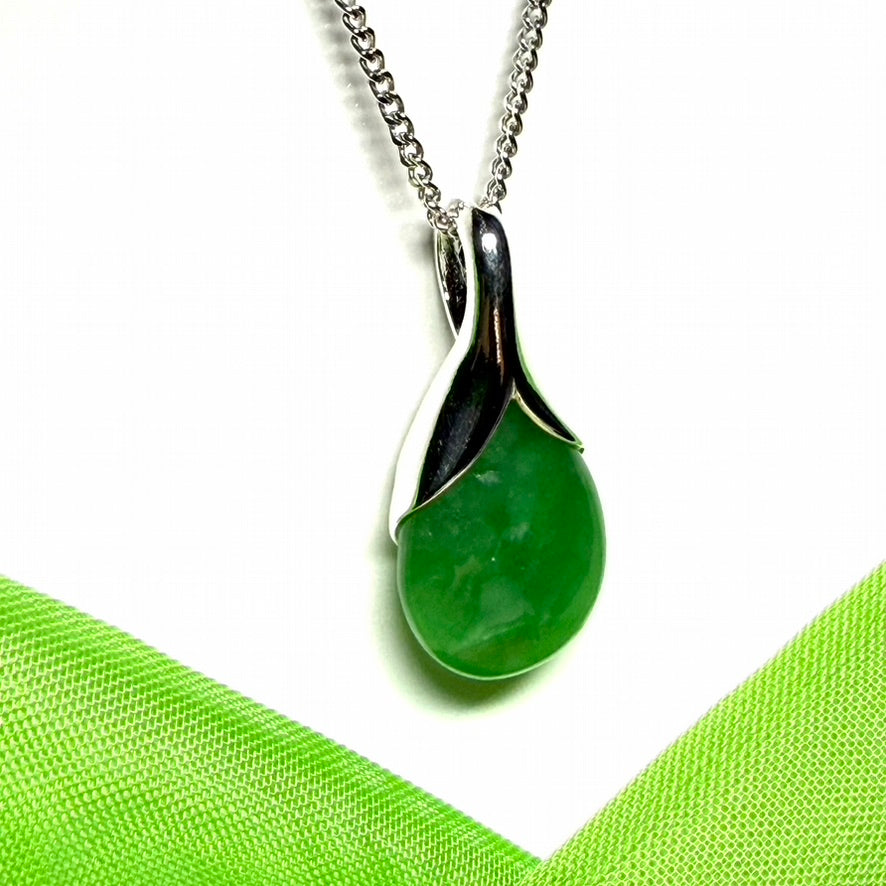 A real green jade necklace in a teardrop or a pear shape including a chain