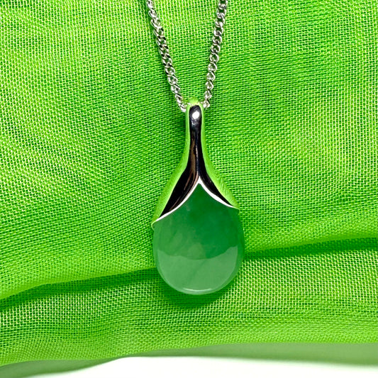 Real green jade necklace in a teardrop or pear shaped including a solid chain
