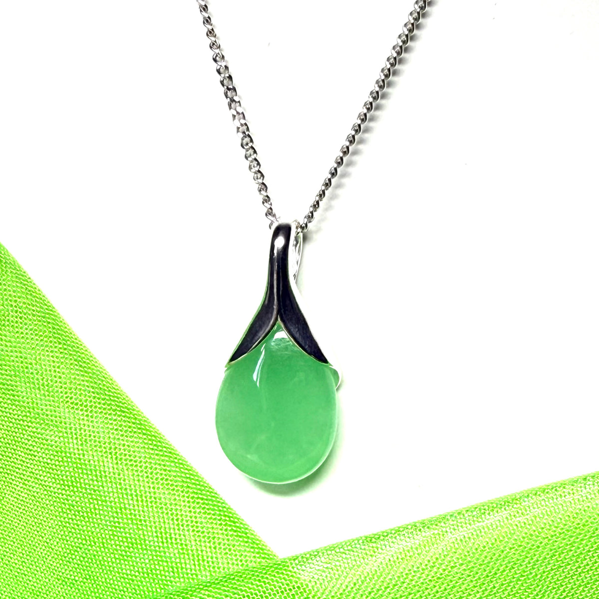A real green jade necklace teardrop with a pear shaped pendant to it