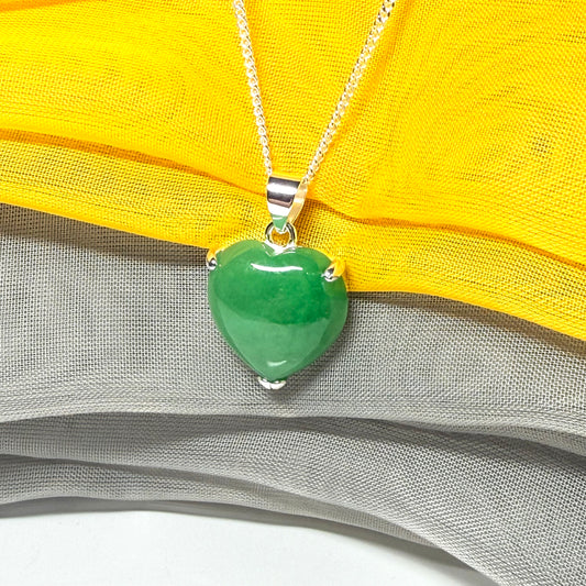 A real green jade pendant heart shaped sterling silver, a traditional design