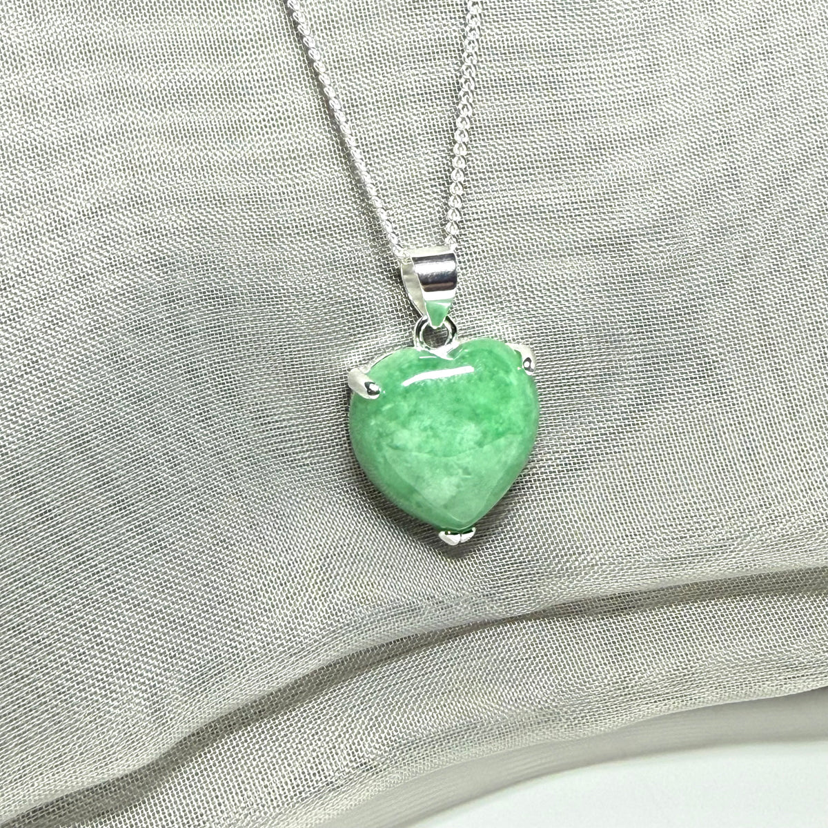 A real green jade pendant heart shaped sterling silver, a gorgeous designed necklace