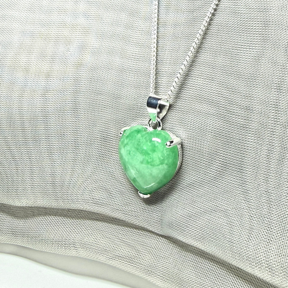 A real green jade pendant heart shaped sterling silver, a gorgeous designed necklace