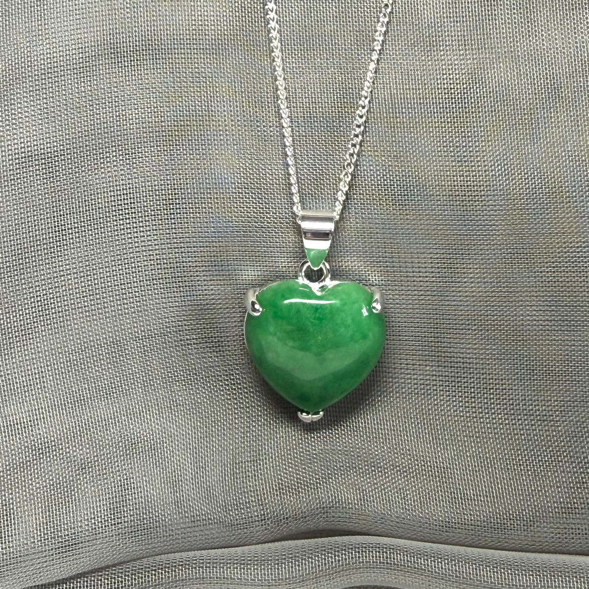 A real green jade pendant heart shaped sterling silver, a traditional designed necklace