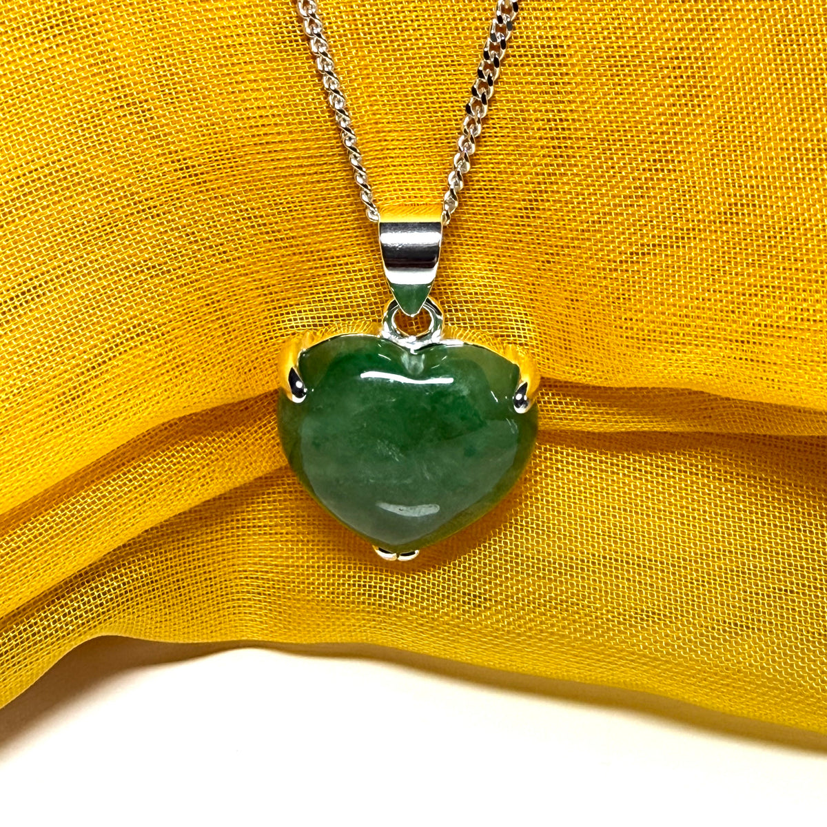 A real green jade pendant heart shaped sterling silver, an exquisite designed necklace