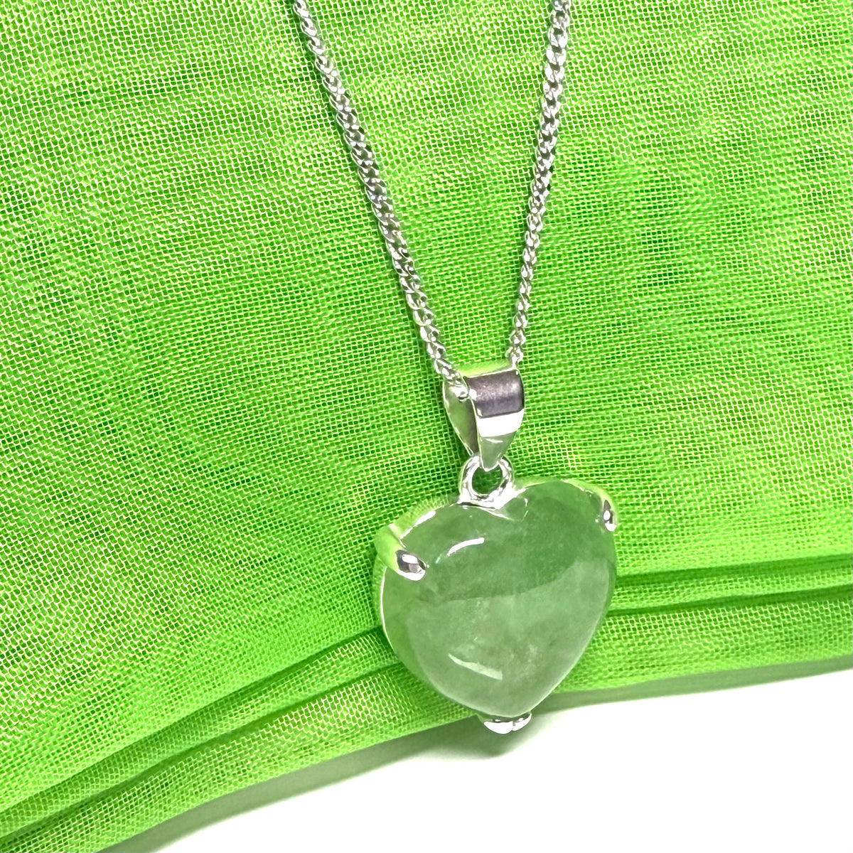A real green jade pendant necklace heart shape sterling silver with chain