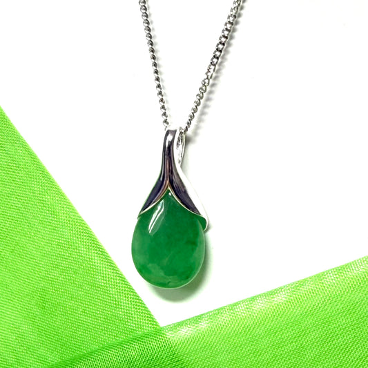 A real green jade pendant necklace in a teardrop shaped or pear shaped with chain
