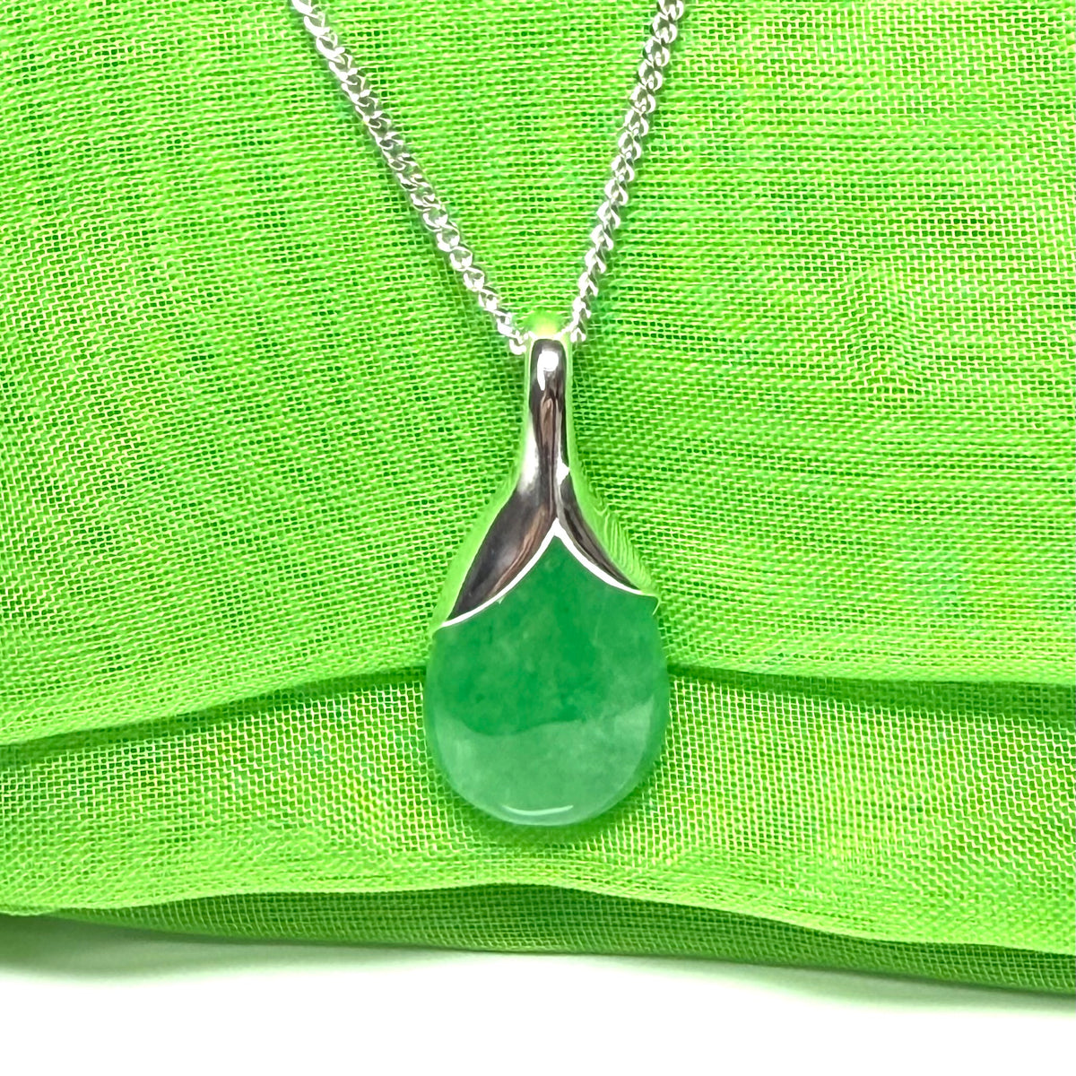 Real green jade tear drop sterling silver pear or teardrop shape pendant to it