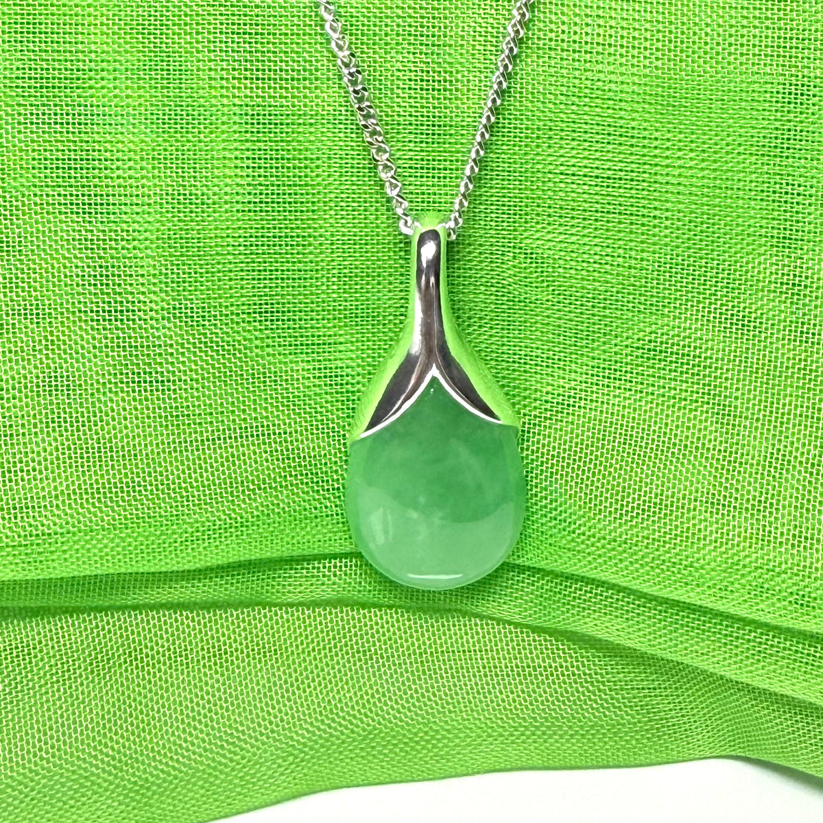 Real green jade tear drop sterling silver pear or teardrop shape pendant to it