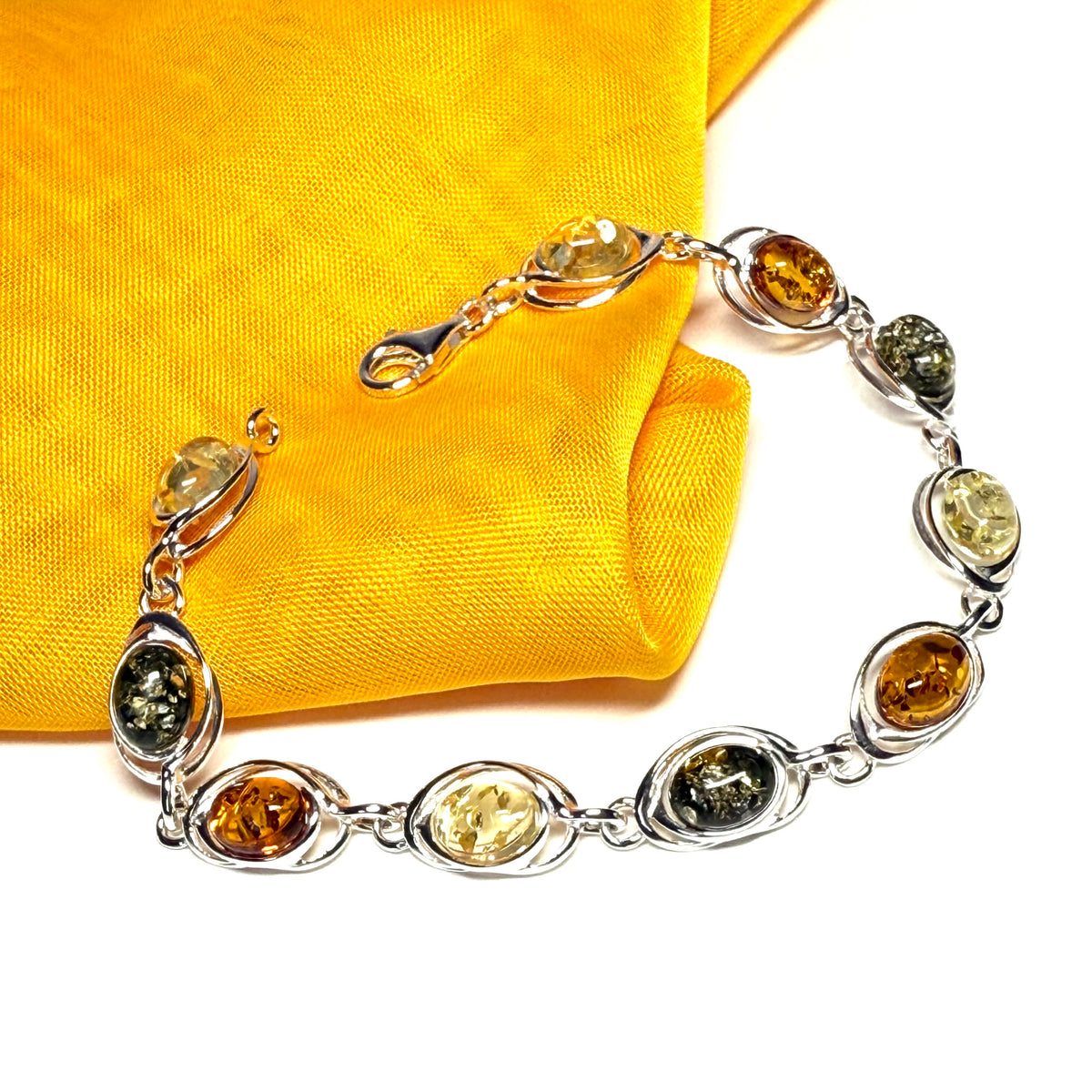 Real multicoloured amber oval shaped bracelet sterling silver