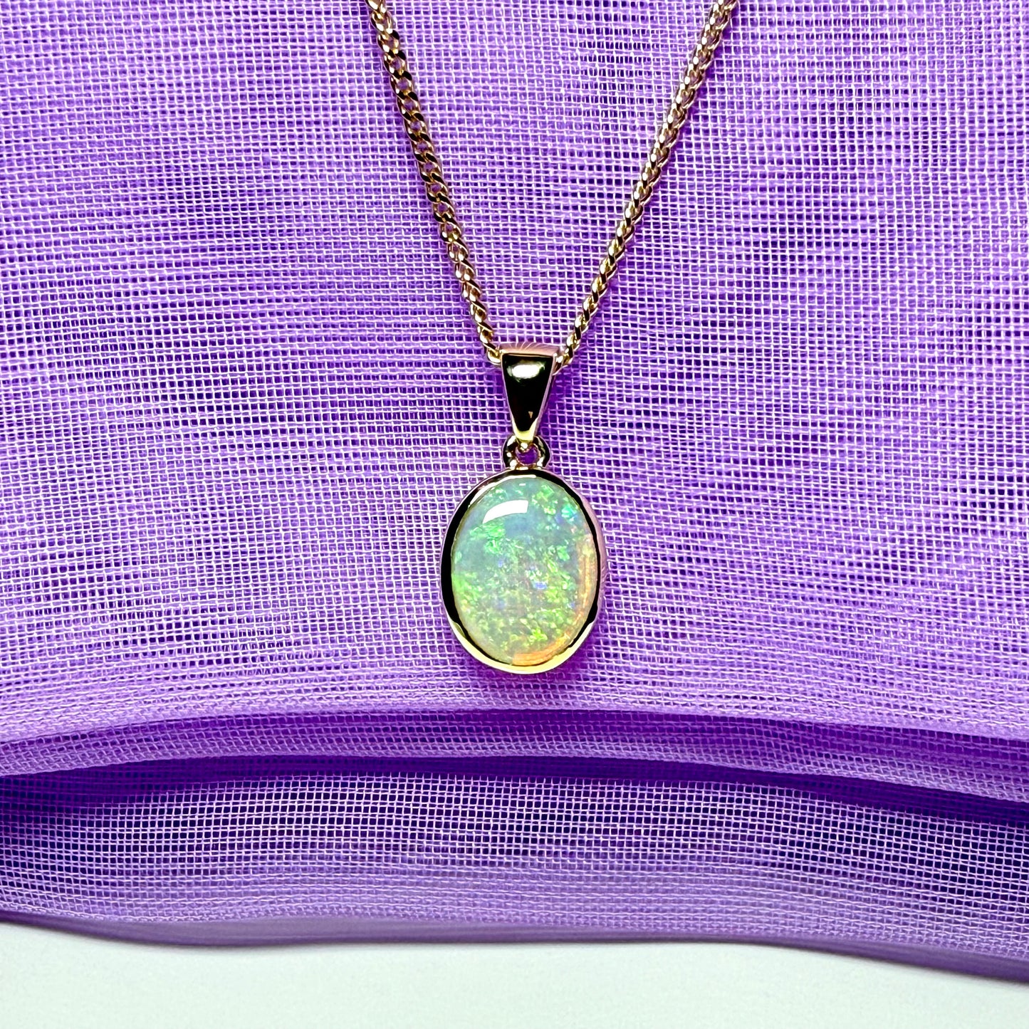 Real opal necklace yellow gold oval pendant smooth rubbed over setting