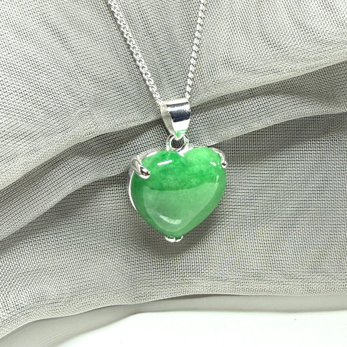 A really beautiful real green jade necklace heart shaped sterling silver, a stunning pendant