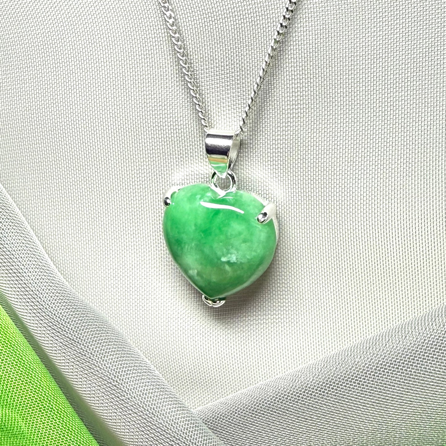 A really stunning pendant with a real green jade necklace heart shaped sterling silver