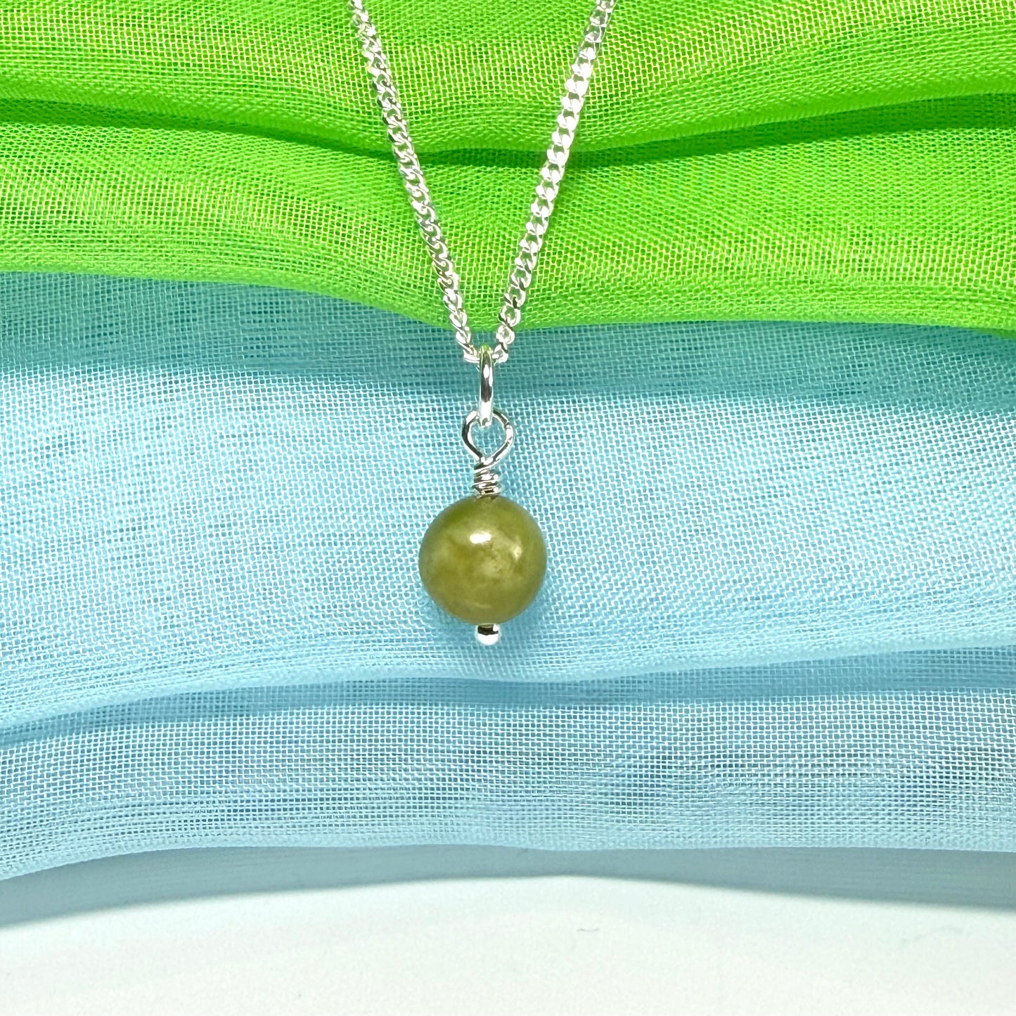 A small real green gypsum necklace ball shaped, a really gorgeous round pendant