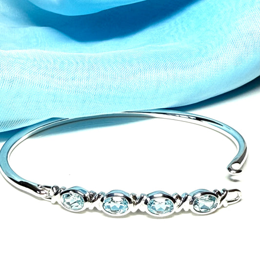 Sterling silver four oval blue topaz kiss bangle